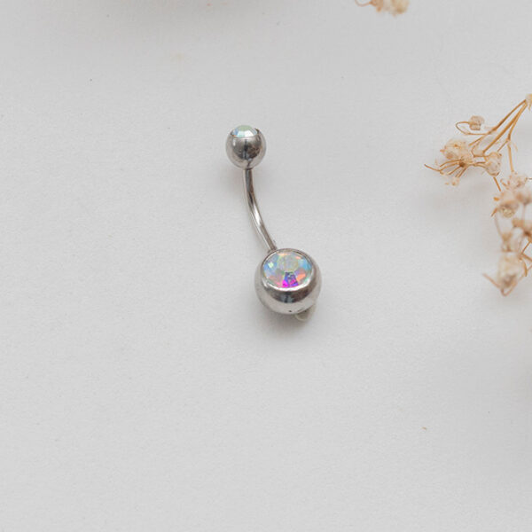 Piercing ombligo rosa claro